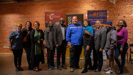 A group photo taken at the Building Arts Equity grant launch that shows staff from SaskCulture, SK Arts, the Multicultural Council of Saskatchewan, and other community partners.