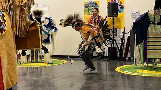 Students in the Small Fires Indigenous Mentorship Program dance Powwow.