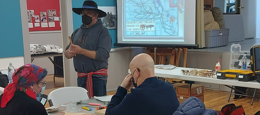 Three people attending a workshop in the Chinook Regional Library in Swift Current.