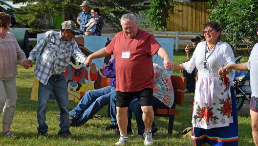 A photo of Jasper Culture and Historical Centre volunteer Donny White taking part in a round dance.