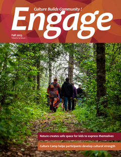 The cover of the Fall 2023 Engage issue, which has a title section that reads ""Culture Builds Community! above the Engage heading and the SaskCulture logo. The cover photo shows a group of people walking through a vibrant green forest. In the bottom of t