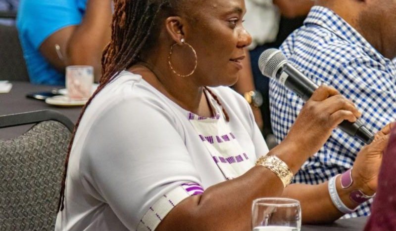 A photo at the group PRIMORG's first event, funded by SGAP. It shows someone speaking into a mic.