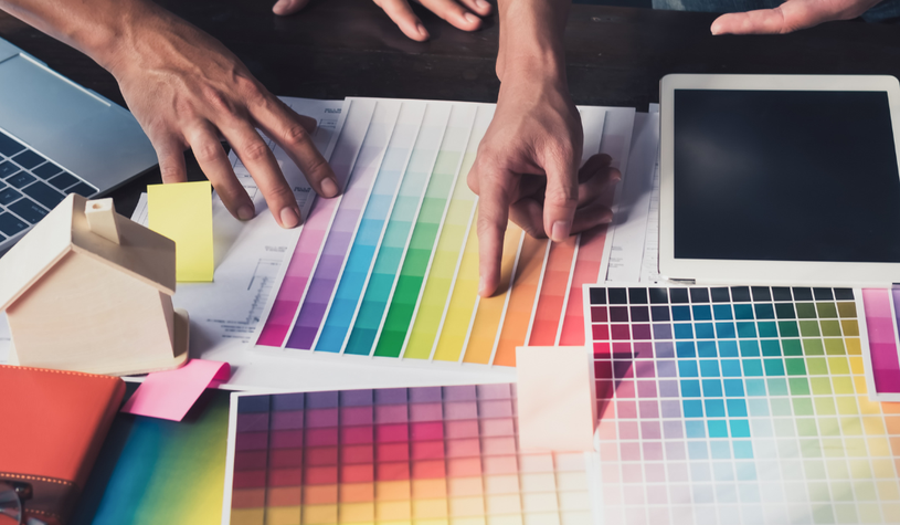 A stock image of people going through colour charts.