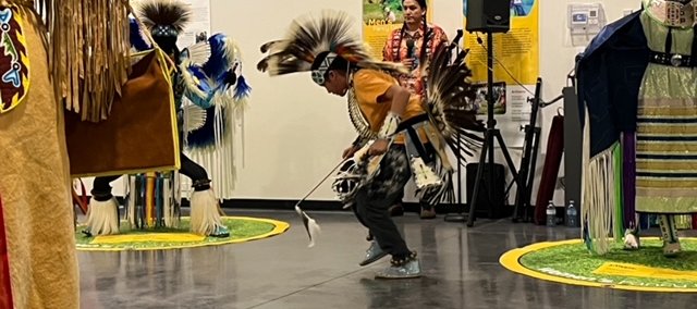 Students in the Small Fires Indigenous Mentorship Program dance Powwow.