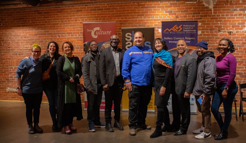 A group of people including SaskCulture, MCOS and SK Arts staff, and artists who were part of consultations for the new Equity in the Arts funding program, smiling at the camera.