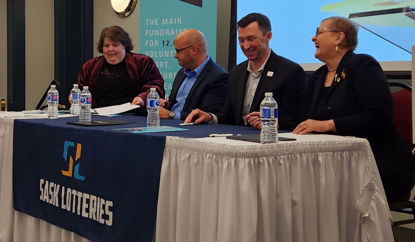 A photo of (from left to right) SaskCulture Board Chair Jan Seibel, Saskatchewan Parks and Recreation Association Board President, Jody Boulet, Sask Sport Chair Michael Rogers, and Parks, Culture and Sport Minister Laura Ross signing the lottery agreement