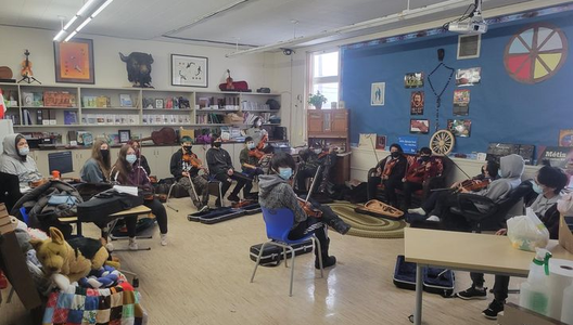 A photo of fiddle players at Back to Batoche Days.