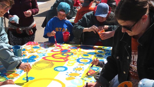 a group of people painting circles