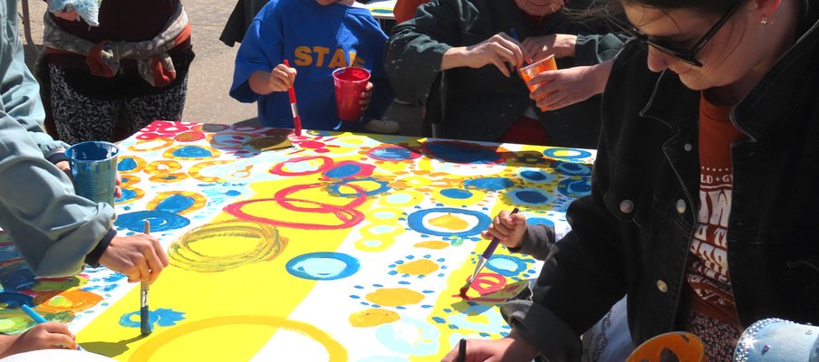 a group of people painting circles