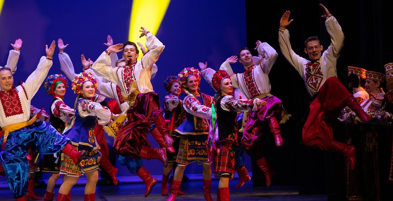 Volunteer performers dancing on a stage at the United for Ukraine concert.