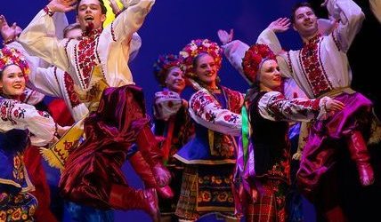 Volunteer performers dancing on a stage at the United for Ukraine concert.