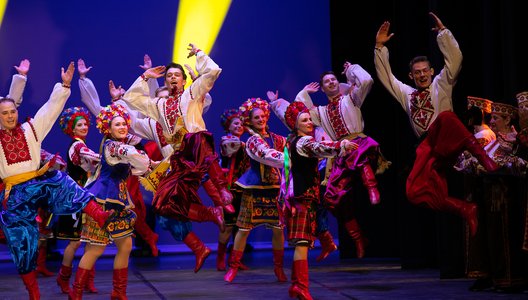 Volunteer performers dancing on a stage at the United for Ukraine concert.