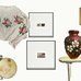 a selection of pieces from the Saskachewanshchyna exhibition including a vyshyvanka, a banjo, a framed pysanka, and framed photographs